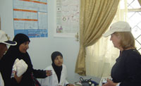 Amal, Head of Reproductive Health Unit, tells USAID Deputy Director during the delegations visit that the number of women in the Antenatal Care Unit has been increasing after renovation.
