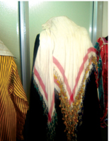 Al-Furrada is a piece of white gauze with tassels (athabat) hanging down.