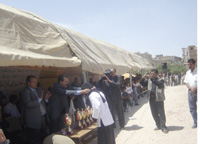 Players raise their flags for each sport in which they participated.