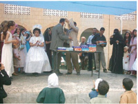 A honoring ceremony for rewarding the active people who organized the summer camps for youth.