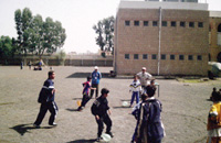 Playing a balloon-game, each team must burst all the other teams balloons first.