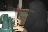Ramzia uses the brail machine to prepare and type the lessons that she uses for her lessons