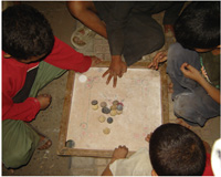 Carrom is a game that both boys and girls like to play either together or separately.