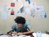 Egyptian cartoonist Makhrouf at work at Ad-Dustour newspaper