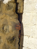 Houses in the village are not suitable  to be lived in after the landslide and might collapse at any moment.  PHOTO BY MAHMOOD ABO KHALIFAH