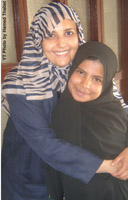 Nojoud with her lawyer in the court.