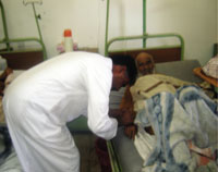 One of the visitors fixes the IV outlet after the nurse refused to do it.