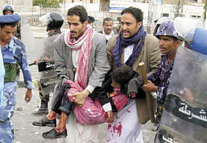 An 11-year old boy was shot dead during a demonstration  in front of the US embassy in Sanaa. Three more Yemenis including a policemen were reported to have been killed. The demonstration was a direct reaction to the start of the US-led war against Iraq on Thursday. Photo by Mohamed Al-Qadhi of Yemen Times