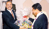 (L-R) Mr. Khosla giving away the grand prize to Dr. Ali Anami
