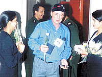 Passengers arriving at the Sanaa International airport are welcomed with flower and issued WED badges