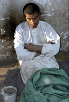 Homeless child after waking up on a street in Sanaa (Yemen Times photo by Peter Willems)