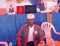 A handicapped posing proudly before exhibits