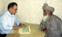 An Afghan registering to vote for the upcoming elections in Kabul, the capital. <br>	(Yemen Times photo by Peter Willems)’/><figcaption>An Afghan registering to vote for the upcoming elections in Kabul, the capital. <br>	(Yemen Times photo by Peter Willems)</figcaption></figure></div></td></tr></table><b><i>By Peter Willems<br>Yemen Times Staff</i></b><br>Members of Parliament in Great Britain last week released a disturbing report on the conditions in Afghanistan and its uncertain future. <br>The House of Commons Foreign Affairs Committee said that there will be a real danger if “resources are not provided soon, that Afghanistan – a fragile state in one of the most sensitive and volatile regions of the world – could implode, with terrible consequences.” <br>Violence in Afghanistan has risen dramatically in the last year-and-a-half. Over 800 people have been killed in the last 12 months. Many of humanitarian aid organizations, assisting to rebuild the war-torn country, have also been targeted. Since the beginning of 2003, over 30 aid workers have been killed. <br>The remnants of the Taliban regime, which have continued to fight US forces in the south, are held responsible for many of the attacks, including assaults in provinces in the north that had been calm since the Taliban were overthrown in late 2001. But warlords leading armed militias and new drug-lords are also seen as backing attacks to keep the country unstable. <br>Doctors Without Borders, a prominent aid agency that has been operating in Afghanistan to provide health care for 24 years, decided last week to pack up and leave the country. On June 2nd, five of its aid workers were ambushed and killed in the Badghis province. <br>The British Foreign Affairs Committee criticized NATO countries for not offering enough forces to secure Afghanistan. Up until now, the NATO-led International Security Assistance Force (ISAF) has been made up of only 6,500 troops, stationed mostly in Kabul, the capital. Twenty thousand US soldiers are preoccupied fighting the Taliban in the south and hunting down Osama bin Laden, the mastermind of Al-Qaeda, near the Afghanistan-Pakistan border. <br>At the NATO conference in Istanbul last June, leaders from member countries promised to increase troop deployments to help bring stability to Afghanistan. But NATO has not only delayed the sending of troops but has failed to find enough countries to commit to fulfill the promise of sending up to 3,500 additional soldiers. NATO officials, including the Secretary-General Jaap de Hoop Scheffer, are now scrambling to find countries that are willing to dispatch forces in September.<br>“We conclude that, welcome though the Istanbul declaration of limited further support for Afghanistan is, fine communiques and ringing declarations are no substitute for delivery of the forces and equipment which Afghanistan needs on the ground,” said the British committee. <br>Last October the United Nations-sponsored a Disarmament, Demobilization and Reintegration program (DDR) began which was aimed to disarm around 60,000 out of an estimated 100,000 militia fighters before the presidential elections are to be held next October. Until now, the program has been stalling: Roughly 10,000 militia fighters have been disarmed, mostly due to the lack of cooperation from Afghan warlords who now control vast territories across the country. <br>In July, President Hamid Karzai signed a decree to try and persuade warlords to cooperate and get the DDR moving forward. <br>“Those who are not cooperating, those who are actively working against DDR, they will be brought to justice,” said the President's Spokesman Jawed Ludin. <br>But analysts believe that it will be difficult for the interim government to enforce its new decree. The Afghan National Army is made up of only 8,300 soldiers. And according to Alexandre Schmidt, Crime Prevention Expert of United Nations Office on Drugs and Crime, Afghanistan is just beginning to develop its judicial system. <br>“The central government outside the capital is very weak, and there is no judicial system yet,” said Schmidt. “The judicial system and law enforcement need to be strengthened, and they also need to be developed outside the capital.” <br>Karzai also tried a couple of weeks ago to strengthen the government's control of the country by removing three militia leaders from their jobs as army commanders and giving them security and local government positions. One was appointed as governor while two others became police chiefs, each one within their own provinces. <br>Analysts, however, have said that the shift will have little effect on the warlords: They have received new titles while still being close to their armed militia fighters.  <br>Some think that the first democratic elections since the Taliban regime fell could help bring stability to the country. The Joint Electoral Management Body (JEMB) – a joint effort between Afghanistan's interim government and the United Nations – has been successful in preparing Afghans to participate in the elections. The JEMB has registered around eight million out of 10 million eligible voters, 40% being women, and has been able to work in unstable areas so that registration has been taking place in all of the 34 provinces. <br>But warlords have been using their power to intimidate voters. In a recent United Nations report on the development of Afghanistan's political rights, Ismail Khan, one of the most powerful warlords ruling the Herat province in the west, was cited as having crushed political opposition and controlling the press and television in his area.  <br>Fighting between Taliban fighters and US troops in the south and attacks on civilians have restricted registration in some areas. In the Zabul province, only 12% of the people have been able to register to vote.<br>There are also fears that violence will increase as the country gets closer to elections, which could endanger the voting process for the presidential elections next fall and parliamentary elections in April 2005. <br>“The JEMB has time and again expressed its concern about the security during the voter registration process and also during the election period itself,” said Said Mohammad Azam, JEMB's Media Relations Officer. “We have always called for provisions of better security where voters, candidates, voter registration and electoral officials feel safe and secure.” <br>The Foreign Affairs Committee also warned that little, if any, assistance has been given to Afghanistan to reduce opium production. The drug industry has prospered since the Taliban regime was ousted. In 2003, over 80,000 hectares were used for poppy cultivation and the country produced 3,600 tons of opium – up from 185 tons in 2001 – taking up 75% of the world market. According to the committee's report, the production of opium is expected to rise again this year. <br>The Taliban is using drug trafficking to finance its insurgency, while over a dozen warlords exploit the drug trade to support building their power base. To fight against the drug trade, that the government initiated an eradication program that destroyed 25,000 hectares of poppy fields in over a half-dozen provinces. But according to United Nations Office on Drugs and Crime, the government has not provided poppy farmers with an alternative crop, and it is expected that farmers will grow poppies again later this year. <br>The Foreign Affairs Committee stressed that if more assistance is not sent soon, Afghanistan could deteriorate much further. <br>“In security terms, Afghanistan is absolutely on a knife edge,” said Sir John Stanley, a member of the Committee. “Countries like Britain, the United States, NATO and round the world either give President Karzai the support he desperately needs now r if we fail to do so I believe there is a very serious risk that the country and security concerns are going to go back very, very seriously and could end up in a situation where everything we have tried to achieve since the removal of the Taliban regime could be set back almost to square one.”<br />——<br />[archive-e:760-v:13-y:2004-d:2004-08-02-p:report]							</div>
													<div class="similar-articles-block">
		<div class="articles-title-block">
			<h5 class="articles-block-title">SIMILAR ARTICLES</h5>
		</div>
		<div class="similar-articles-block-colls coll-2">
							<div>
					<article>
	<a class="article-card" href="https://yementimes.com/heavy-rains-and-earthquakes-displace-people-in-ibb-archives2010-1407-front/">
					<div class="article-card-img">
									<img width="400" height="261" src="https://yementimes.com/wp-content/uploads/2010/10/local1407main_1.jpg" class="attachment-post-thumbnail size-post-thumbnail wp-post-image" alt="" decoding="async" loading="lazy" srcset="https://yementimes.com/wp-content/uploads/2010/10/local1407main_1.jpg 400w, https://yementimes.com/wp-content/uploads/2010/10/local1407main_1-300x196.jpg 300w" sizes="auto, (max-width: 400px) 100vw, 400px" />															</div>
				<div class="article-card-caption">
			<h4 class="article-card-title">Heavy rains and earthquakes displace people in Ibb [Archives:2010/1407/Front]</h4>
			<p>By Ali Saeed IBB, Oct. 11 – Mohammad Nu’man, 27, in Al-Makhadr district, Ibb, and…</p>
			<div class="article-card-caption-bottom">
				<div class="article-card-author">archive</div>
				<div class="article-card-date">October 14 2010</div>
			</div>
		</div>
	</a>
</article>				</div>
							<div>
					<article>
	<a class="article-card" href="https://yementimes.com/from-damascus-to-ashkelon-to-qaherathe-transfer-of-the-sacred-head-of-husain-ibn-ali-archives2009-1228-culture/">
					<div class="article-card-img">
									<img width="200" height="105" src="https://yementimes.com/wp-content/uploads/2009/01/culture1_1-1.jpg" class="attachment-post-thumbnail size-post-thumbnail wp-post-image" alt="" decoding="async" loading="lazy" />															</div>
				<div class="article-card-caption">
			<h4 class="article-card-title">From Damascus to Ashkelon to QaheraThe transfer of the Sacred Head of Husain ibn Ali [Archives:2009/1228/Culture]</h4>
			<p>Qazi Dr. Shaikh Abbas Borhanyqazishkborhany@hotmail.comThe most beloved grandson of Rasulullah(S), Al Imam al Husain ibn…</p>
			<div class="article-card-caption-bottom">
				<div class="article-card-author">archive</div>
				<div class="article-card-date">January 26 2009</div>
			</div>
		</div>
	</a>
</article>				</div>
					</div>
	</div>
					</div>
					<div class="sidebar-right">
	<div class="widget widget-subscribe-form">
	<div class="articles-title-block">
		<h5 class="articles-block-title">SUBSCRIBE NOW</h5>
	</div>
	<form class="subscribe-form" method="post" action="/?na=s">
		<div class="form-group">
			<input type="hidden" name="nlang" value="">
			<input class="form-control" type="email" name="ne" placeholder="Enter your email" value="" required>
			<button type="submit" class="btn"><span>SUBSCRIBE</span></button>
		</div>
	</form>
</div><input type="hidden" name="nlang" value="">
						<div class="widget">
			<div class="articles-title-block">
				<h5 class="articles-block-title">CATEGORIES</h5>
			</div>
			<div>
				<nav>
					<ul class="navbar-collapse-mnu">
													<li><a href="https://yementimes.com/category/opinion/">Opinion</a></li>
													<li><a href="https://yementimes.com/category/archived-pdf/">Archived PDF</a></li>
													<li><a href="https://yementimes.com/category/interview/">Interview</a></li>
													<li><a href="https://yementimes.com/category/featured/">Featured</a></li>
													<li><a href="https://yementimes.com/category/community/">Community</a></li>
													<li><a href="https://yementimes.com/category/front-featured/">Front Featured</a></li>
													<li><a href="https://yementimes.com/category/front/">Front Page</a></li>
													<li><a href="https://yementimes.com/category/ln-featured/">Local News Featured</a></li>
													<li><a href="https://yementimes.com/category/focus/">Focus</a></li>
													<li><a href="https://yementimes.com/category/economy-featured/">Business & Economy Featured</a></li>
													<li><a href="https://yementimes.com/category/lastpage/">Last Page</a></li>
													<li><a href="https://yementimes.com/category/culture-featured/">Culture & Society Featured</a></li>
													<li><a href="https://yementimes.com/category/ln/">Local News</a></li>
													<li><a href="https://yementimes.com/category/supplementary/">Supplementary</a></li>
													<li><a href="https://yementimes.com/category/press/">Press Review</a></li>
													<li><a href="https://yementimes.com/category/sports/">Sports</a></li>
													<li><a href="https://yementimes.com/category/view/">Viewpoint</a></li>
													<li><a href="https://yementimes.com/category/letters/">Letters to the Editor</a></li>
													<li><a href="https://yementimes.com/category/law-diplomacy/">Law & Diplomacy</a></li>
													<li><a href="https://yementimes.com/category/uncategorised/">Uncategorised</a></li>
													<li><a href="https://yementimes.com/category/reportage/">Reportage</a></li>
													<li><a href="https://yementimes.com/category/cartoon/">Cartoon</a></li>
													<li><a href="https://yementimes.com/category/governance/">Governance</a></li>
													<li><a href="https://yementimes.com/category/health/">Health & Environment</a></li>
													<li><a href="https://yementimes.com/category/science-technology/">Science & Technology</a></li>
													<li><a href="https://yementimes.com/category/economy/">Business & Economy</a></li>
													<li><a href="https://yementimes.com/category/education/">Education</a></li>
													<li><a href="https://yementimes.com/category/culture/">Culture & Society</a></li>
											</ul>
				</nav>
			</div>
		</div>
				<div class="widget">
			<div class="articles-title-block">
				<h5 class="articles-block-title">SHARE THIS ARTICLE ON</h5>
				<div><div class="addtoany_shortcode"><div class="a2a_kit a2a_kit_size_52 addtoany_list" data-a2a-url="https://yementimes.com/afghanistan-on-the-brink-of-disaster-archives2004-760-reportage/" data-a2a-title="Afghanistan: on the brink of disaster [Archives:2004/760/Reportage]"><a class="a2a_button_twitter" href="https://www.addtoany.com/add_to/twitter?linkurl=https%3A%2F%2Fyementimes.com%2Fafghanistan-on-the-brink-of-disaster-archives2004-760-reportage%2F&linkname=Afghanistan%3A%20on%20the%20brink%20of%20disaster%20%5BArchives%3A2004%2F760%2FReportage%5D" title="Twitter" rel="nofollow noopener" target="_blank"></a><a class="a2a_button_facebook" href="https://www.addtoany.com/add_to/facebook?linkurl=https%3A%2F%2Fyementimes.com%2Fafghanistan-on-the-brink-of-disaster-archives2004-760-reportage%2F&linkname=Afghanistan%3A%20on%20the%20brink%20of%20disaster%20%5BArchives%3A2004%2F760%2FReportage%5D" title="Facebook" rel="nofollow noopener" target="_blank"></a><a class="a2a_button_linkedin" href="https://www.addtoany.com/add_to/linkedin?linkurl=https%3A%2F%2Fyementimes.com%2Fafghanistan-on-the-brink-of-disaster-archives2004-760-reportage%2F&linkname=Afghanistan%3A%20on%20the%20brink%20of%20disaster%20%5BArchives%3A2004%2F760%2FReportage%5D" title="LinkedIn" rel="nofollow noopener" target="_blank"></a></div></div></div>
			</div>
		</div>
	</div>
				</div>				
			</div>
		</section>
	</main>
<footer class="main-foot">
	<div class="container">
		<div class="navbar-foot">
							<div class="navbar-foot-logo-block">
					<div class="navbar-foot-logo">
						<a href="https://yementimes.com">
							<img src="https://yementimes.com/wp-content/uploads/2023/02/yemens.png" alt="yemens">
						</a>
					</div>
				</div>
						<div class="foot-menu-wrap coll-4">
				<div>
											<div class="foot-title">Footer</div>
						<nav>
							<ul id="menu-footer" class="foot-menu coll-2"><li id="menu-item-103253" class="menu-item menu-item-type-post_type menu-item-object-page menu-item-103253"><a href="https://yementimes.com/contact/">Contact Us</a></li>
<li id="menu-item-103254" class="menu-item menu-item-type-post_type menu-item-object-page menu-item-103254"><a href="https://yementimes.com/about/">About Us</a></li>
</ul>						</nav>
									</div>
				<div>
											<div class="foot-title">Quicklinks</div>
						<nav>
							<ul id="menu-quicklinks" class="foot-menu"><li id="menu-item-273" class="menu-item menu-item-type-post_type menu-item-object-page menu-item-273"><a href="https://yementimes.com/archive/">Archive</a></li>
</ul>						</nav>
									</div>
				<div>
											<div class="foot-title">Follow Us</div>
																<nav>
							<ul class="social-menu">
																	<li><a href="https://twitter.com/theyementimes" target="_blank"><?xml version="1.0" encoding="UTF-8"?> <svg xmlns="http://www.w3.org/2000/svg" width="22.235" height="27.376" viewBox="0 0 22.235 27.376"><path d="M24.562,8.922c.017.243.017.486.017.73A15.854,15.854,0,0,1,8.616,25.615,15.856,15.856,0,0,1,0,23.1a11.607,11.607,0,0,0,1.355.069,11.237,11.237,0,0,0,6.966-2.4,5.621,5.621,0,0,1-5.246-3.891,7.076,7.076,0,0,0,1.06.087,5.934,5.934,0,0,0,1.477-.191,5.612,5.612,0,0,1-4.5-5.507V11.2a5.651,5.651,0,0,0,2.536.712,5.619,5.619,0,0,1-1.737-7.5A15.948,15.948,0,0,0,13.48,10.277a6.334,6.334,0,0,1-.139-1.285,5.616,5.616,0,0,1,9.71-3.839A11.047,11.047,0,0,0,26.612,3.8,5.6,5.6,0,0,1,24.145,6.89a11.248,11.248,0,0,0,3.231-.869,12.061,12.061,0,0,1-2.814,2.9Z" transform="translate(25.615) rotate(90)" fill="currentColor"></path></svg> </a></li>
																	<li><a href="https://www.linkedin.com/company/yementimes" target="_blank"><?xml version="1.0" encoding="UTF-8"?> <svg xmlns="http://www.w3.org/2000/svg" width="24.325" height="24.325" viewBox="0 0 24.325 24.325"><path d="M5.445,24.326H.4V8.085H5.445ZM2.921,5.87A2.935,2.935,0,1,1,5.841,2.921,2.945,2.945,0,0,1,2.921,5.87Zm21.4,18.456H19.288V16.42c0-1.884-.038-4.3-2.622-4.3-2.622,0-3.024,2.047-3.024,4.165v8.041H8.6V8.085h4.837V10.3h.071a5.3,5.3,0,0,1,4.772-2.623c5.1,0,6.042,3.361,6.042,7.727v8.921Z" transform="translate(24.326) rotate(90)" fill="currentColor"></path></svg> </a></li>
															</ul>
						</nav>
									</div>
				<div class="foot-subscribe-block">
	<div class="foot-subscribe">
		<div class="foot-title">Subscribe Now</div>
		<form class="subscribe-form" method="post" action="/?na=s">
			<div class="form-group">
				<input type="hidden" name="nlang" value="">
				<input class="form-control white" type="email" name="ne" placeholder="Enter your email" value="" required>
				<button type="submit" class="btn btn-simple btn-red"><span>SUBSCRIBE</span><div class="arrow"></div></button>
			</div>
		</form>
	</div>
</div><input type="hidden" name="nlang" value="">
			</div>
							<div class="foot-bottom-line">
											<div><p>© 2026 The Yemen Times. All rights reserved.</p></div>
																<nav>
													</nav>
									            
						
				</div>
					</div>
	</div>
</footer>
<script type="speculationrules">
{"prefetch":[{"source":"document","where":{"and":[{"href_matches":"/*"},{"not":{"href_matches":["/wp-*.php","/wp-admin/*","/wp-content/uploads/*","/wp-content/*","/wp-content/plugins/*","/wp-content/themes/yementimes/*","/*\\?(.+)"]}},{"not":{"selector_matches":"a[rel~=\"nofollow\"]"}},{"not":{"selector_matches":".no-prefetch, .no-prefetch a"}}]},"eagerness":"conservative"}]}
</script>
<script id="ckyBannerTemplate" type="text/template"><div class="cky-overlay cky-hide"></div><div class="cky-btn-revisit-wrapper cky-revisit-hide" data-cky-tag="revisit-consent" data-tooltip="Cookie Settings" style="background-color:#CF2E34"> <button class="cky-btn-revisit" aria-label="Cookie Settings"> <img src="https://yementimes.com/wp-content/plugins/cookie-law-info/lite/frontend/images/revisit.svg" alt="Revisit consent button"> </button></div><div class="cky-consent-container cky-hide" tabindex="0"> <div class="cky-consent-bar" data-cky-tag="notice" style="background-color:#FFFFFF;border-color:#f4f4f4">  <div class="cky-notice"> <p class="cky-title" role="heading" aria-level="1" data-cky-tag="title" style="color:#212121">We value your privacy</p><div class="cky-notice-group"> <div class="cky-notice-des" data-cky-tag="description" style="color:#212121"> <p>We use cookies to enhance your browsing experience, serve personalized ads or content, and analyze our traffic. By clicking "Accept All", you consent to our use of cookies.</p> </div><div class="cky-notice-btn-wrapper" data-cky-tag="notice-buttons"> <button class="cky-btn cky-btn-customize" aria-label="Customize" data-cky-tag="settings-button" style="color:#CF2E34;background-color:transparent;border-color:#CF2E34">Customize</button> <button class="cky-btn cky-btn-reject" aria-label="Reject All" data-cky-tag="reject-button" style="color:#CF2E34;background-color:transparent;border-color:#CF2E34">Reject All</button> <button class="cky-btn cky-btn-accept" aria-label="Accept All" data-cky-tag="accept-button" style="color:#FFFFFF;background-color:#CF2E34;border-color:#CF2E34">Accept All</button>  </div></div></div></div></div><div class="cky-modal" tabindex="0"> <div class="cky-preference-center" data-cky-tag="detail" style="color:#212121;background-color:#FFFFFF;border-color:#f4f4f4"> <div class="cky-preference-header"> <span class="cky-preference-title" role="heading" aria-level="1" data-cky-tag="detail-title" style="color:#212121">Customize Consent Preferences</span> <button class="cky-btn-close" aria-label="Close" data-cky-tag="detail-close"> <img src="https://yementimes.com/wp-content/plugins/cookie-law-info/lite/frontend/images/close.svg" alt="Close"> </button> </div><div class="cky-preference-body-wrapper"> <div class="cky-preference-content-wrapper" data-cky-tag="detail-description" style="color:#212121"> <p>We use cookies to help you navigate efficiently and perform certain functions. You will find detailed information about all cookies under each consent category below.</p><p>The cookies that are categorized as "Necessary" are stored on your browser as they are essential for enabling the basic functionalities of the site. </p><p>We also use third-party cookies that help us analyze how you use this website, store your preferences, and provide the content and advertisements that are relevant to you. These cookies will only be stored in your browser with your prior consent.</p><p>You can choose to enable or disable some or all of these cookies but disabling some of them may affect your browsing experience.</p> </div><div class="cky-accordion-wrapper" data-cky-tag="detail-categories"> <div class="cky-accordion" id="ckyDetailCategorynecessary"> <div class="cky-accordion-item"> <div class="cky-accordion-chevron"><i class="cky-chevron-right"></i></div> <div class="cky-accordion-header-wrapper"> <div class="cky-accordion-header"><button class="cky-accordion-btn" aria-label="Necessary" data-cky-tag="detail-category-title" style="color:#212121">Necessary</button><span class="cky-always-active">Always Active</span> <div class="cky-switch" data-cky-tag="detail-category-toggle"><input type="checkbox" id="ckySwitchnecessary"></div> </div> <div class="cky-accordion-header-des" data-cky-tag="detail-category-description" style="color:#212121"> <p>Necessary cookies are required to enable the basic features of this site, such as providing secure log-in or adjusting your consent preferences. These cookies do not store any personally identifiable data.</p></div> </div> </div> <div class="cky-accordion-body"> <div class="cky-audit-table" data-cky-tag="audit-table" style="color:#212121;background-color:#f4f4f4;border-color:#ebebeb"><p class="cky-empty-cookies-text">No cookies to display.</p></div> </div> </div><div class="cky-accordion" id="ckyDetailCategoryfunctional"> <div class="cky-accordion-item"> <div class="cky-accordion-chevron"><i class="cky-chevron-right"></i></div> <div class="cky-accordion-header-wrapper"> <div class="cky-accordion-header"><button class="cky-accordion-btn" aria-label="Functional" data-cky-tag="detail-category-title" style="color:#212121">Functional</button><span class="cky-always-active">Always Active</span> <div class="cky-switch" data-cky-tag="detail-category-toggle"><input type="checkbox" id="ckySwitchfunctional"></div> </div> <div class="cky-accordion-header-des" data-cky-tag="detail-category-description" style="color:#212121"> <p>Functional cookies help perform certain functionalities like sharing the content of the website on social media platforms, collecting feedback, and other third-party features.</p></div> </div> </div> <div class="cky-accordion-body"> <div class="cky-audit-table" data-cky-tag="audit-table" style="color:#212121;background-color:#f4f4f4;border-color:#ebebeb"><p class="cky-empty-cookies-text">No cookies to display.</p></div> </div> </div><div class="cky-accordion" id="ckyDetailCategoryanalytics"> <div class="cky-accordion-item"> <div class="cky-accordion-chevron"><i class="cky-chevron-right"></i></div> <div class="cky-accordion-header-wrapper"> <div class="cky-accordion-header"><button class="cky-accordion-btn" aria-label="Analytics" data-cky-tag="detail-category-title" style="color:#212121">Analytics</button><span class="cky-always-active">Always Active</span> <div class="cky-switch" data-cky-tag="detail-category-toggle"><input type="checkbox" id="ckySwitchanalytics"></div> </div> <div class="cky-accordion-header-des" data-cky-tag="detail-category-description" style="color:#212121"> <p>Analytical cookies are used to understand how visitors interact with the website. These cookies help provide information on metrics such as the number of visitors, bounce rate, traffic source, etc.</p></div> </div> </div> <div class="cky-accordion-body"> <div class="cky-audit-table" data-cky-tag="audit-table" style="color:#212121;background-color:#f4f4f4;border-color:#ebebeb"><p class="cky-empty-cookies-text">No cookies to display.</p></div> </div> </div><div class="cky-accordion" id="ckyDetailCategoryperformance"> <div class="cky-accordion-item"> <div class="cky-accordion-chevron"><i class="cky-chevron-right"></i></div> <div class="cky-accordion-header-wrapper"> <div class="cky-accordion-header"><button class="cky-accordion-btn" aria-label="Performance" data-cky-tag="detail-category-title" style="color:#212121">Performance</button><span class="cky-always-active">Always Active</span> <div class="cky-switch" data-cky-tag="detail-category-toggle"><input type="checkbox" id="ckySwitchperformance"></div> </div> <div class="cky-accordion-header-des" data-cky-tag="detail-category-description" style="color:#212121"> <p>Performance cookies are used to understand and analyze the key performance indexes of the website which helps in delivering a better user experience for the visitors.</p></div> </div> </div> <div class="cky-accordion-body"> <div class="cky-audit-table" data-cky-tag="audit-table" style="color:#212121;background-color:#f4f4f4;border-color:#ebebeb"><p class="cky-empty-cookies-text">No cookies to display.</p></div> </div> </div><div class="cky-accordion" id="ckyDetailCategoryadvertisement"> <div class="cky-accordion-item"> <div class="cky-accordion-chevron"><i class="cky-chevron-right"></i></div> <div class="cky-accordion-header-wrapper"> <div class="cky-accordion-header"><button class="cky-accordion-btn" aria-label="Advertisement" data-cky-tag="detail-category-title" style="color:#212121">Advertisement</button><span class="cky-always-active">Always Active</span> <div class="cky-switch" data-cky-tag="detail-category-toggle"><input type="checkbox" id="ckySwitchadvertisement"></div> </div> <div class="cky-accordion-header-des" data-cky-tag="detail-category-description" style="color:#212121"> <p>Advertisement cookies are used to provide visitors with customized advertisements based on the pages you visited previously and to analyze the effectiveness of the ad campaigns.</p></div> </div> </div> <div class="cky-accordion-body"> <div class="cky-audit-table" data-cky-tag="audit-table" style="color:#212121;background-color:#f4f4f4;border-color:#ebebeb"><p class="cky-empty-cookies-text">No cookies to display.</p></div> </div> </div> </div></div><div class="cky-footer-wrapper"> <span class="cky-footer-shadow"></span> <div class="cky-prefrence-btn-wrapper" data-cky-tag="detail-buttons"> <button class="cky-btn cky-btn-reject" aria-label="Reject All" data-cky-tag="detail-reject-button" style="color:#CF2E34;background-color:transparent;border-color:#CF2E34"> Reject All </button> <button class="cky-btn cky-btn-preferences" aria-label="Save My Preferences" data-cky-tag="detail-save-button" style="color:#CF2E34;background-color:transparent;border-color:#CF2E34"> Save My Preferences </button> <button class="cky-btn cky-btn-accept" aria-label="Accept All" data-cky-tag="detail-accept-button" style="color:#FFFFFF;background-color:#CF2E34;border-color:#CF2E34"> Accept All </button> </div></div></div></div></script><script src="https://yementimes.com/wp-includes/js/dist/hooks.min.js?ver=dd5603f07f9220ed27f1" id="wp-hooks-js"></script>
<script src="https://yementimes.com/wp-includes/js/dist/i18n.min.js?ver=c26c3dc7bed366793375" id="wp-i18n-js"></script>
<script id="wp-i18n-js-after">
wp.i18n.setLocaleData( { 
