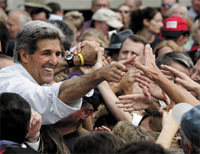 U.S. Democratic presidential nominee John Kerry greets the crowd at a campaign rally in Akron, Ohio September 4, 2004. Kerry on Saturday rebuked President George W. Bush for trying to bamboozle U.S. voters and hiding behind the news of Hurricane Frances in Florida and a bloody school siege in Russia. Kerry questioned the timing of the Bush administrations announcement that older Americans will have to pay about 17 percent more next year, the largest increase in Medicares history, for their government-run health insurance.      REUTERS