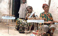 Banaadiri women weavering outdoors