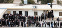 Iraqi voters queue outside a polling station in the capital Baghdad Jan. 30. Millions of Iraqis flocked to vote in a historic election Sunday, defying insurgents who killed 25 people in bloody attacks aimed at wrecking the poll. Iraqis, some ululating with joy, others hiding their faces in fear, voted in much higher-than-expected numbers in their first multi-party election in half a century. Election commission officials put the turnout at 72 percent.   <br> REUTERS’/><figcaption>Iraqi voters queue outside a polling station in the capital Baghdad Jan. 30. Millions of Iraqis flocked to vote in a historic election Sunday, defying insurgents who killed 25 people in bloody attacks aimed at wrecking the poll. Iraqis, some ululating with joy, others hiding their faces in fear, voted in much higher-than-expected numbers in their first multi-party election in half a century. Election commission officials put the turnout at 72 percent.   <br> REUTERS</figcaption></figure></div></td></tr></table>BAGHDAD, Jan 30 (Reuters) – Millions of Iraqis flocked to vote in a historic election on Sunday, defying insurgents who killed 33 people in bloody attacks aimed at wrecking the poll.<br><br>Voters, some ululating with joy, others hiding their faces in fear, cast ballots in higher-than-expected numbers in their first multi-party election in half a century.<br><br>Election officials estimated the turnout at 72 percent, a figure that ) if confirmed ) would enhance the legitimacy of  a national assembly that will choose Iraq's new leaders.  But in parts of Iraq's Sunni Arab heartland, where the insurgency has been bloodiest, some streets and polling stations were deserted.<br><br>Militants struck mainly in Baghdad, rocking the capital with nine suicide blasts in rapid succession. The Iraqi wing of al Qaeda claimed responsibility.<br><br>Casting his vote in Baghdad's heavily fortified Green Zone, interim Prime Minister Iyad Allawi urged his countrymen to face down the insurgents.<br><br>“This is a historic moment for Iraq, a day when Iraqis can hold their heads high because they are challenging the terrorists and starting to write their future with their own hands,” he told reporters.<br><br>A low Sunni turnout could raise questions about the credibility of the first election since Saddam Hussein was toppled in a U.S.-led invasion in April 2003.<br><br>Many fear that instead of quelling the anti-U.S. revolt, the poll could foment sectarian strife by further alienating Sunnis, delaying any withdrawal of American-led forces from the country.<br><br>Despite draconian security measures imposed by Iraq's U.S.-backed interim government, militants waged a sustained assault to try to frighten people away from the polls.<br><br><br><br>Suicide Bombings<br><br>At least 27 people were killed in Baghdad attacks, including suicide bombings carried out by a Syrian and a Chechen, interim Interior Minister Falab al-Naqib told Reuters.<br><br>The deadliest attack was when a man with explosives strapped to his body blew himself up in the queue at a polling station in east Baghdad, killing six people, an official said.<br><br>Another suicide bomber killed four people at a voting centre in the Sadr City slums, a Shi'ite stronghold. A suicide bomb also killed three people in a bus carrying voters south of Baghdad, Polish military in the area said.<br><br>Despite Sunday's violence, election officials said by mid-afternoon that turnout had been far above expectations, though they gave no voter numbers. The government had set a target of at least 50 percent of Iraq's 13 million registered voters as the barometer of success.<br><br>With international monitors mostly staying away for fear of kidnapping, it was impossible to assess the fairness of the election or validity of the turnout figures.<br><br>Polling stations officially closed at 5 p.m. (1400 GMT), but officials said people already in line could still vote.<br><br>Voters formed long queues in Shi'ite areas and the Kurdish north, where officials said turnout topped 90 and 80 percent, respectively. Many chanted and clapped. Some walked for miles.<br><br>“This is a wedding for all Iraqis. I congratulate all Iraqis on their newfound freedom,” said Jaida Hamza, dressed in a black Islamic robe, in the Shi'ite shrine city of Najaf.<br><br>Even in Falluja, the battle-scarred Sunni city that was a militant stronghold until a U.S. assault in November, a slow stream of people turned out, confounding expectations.<br><br>Militant groups, including al Qaeda's leader in Iraq, Abu Musab al-Zarqawi, had declared war on democracy, vowing to kill any “infidel” who voted.<br><br>Interim Defence Minister Hazim al-Shaalan said Sunday's violence would have been much worse if there had not been stringent measures banning private cars from the streets, which prevented even deadlier attacks with car bombs.<br><br><br><br>Tight security<br><br>To try to prevent violence, streets were barricaded, borders sealed, airports closed and only official vehicles allowed out.<br><br>Iraq's 60 percent-majority Shi'ites, oppressed for decades under Saddam, were expected to dominate the polls. Kurds, who make up nearly a fifth of Iraqis, want a result that enables them to enshrine their autonomous rule in the north.<br><br>Several Sunni parties are boycotting the polls, saying the insurgency raging in their areas and the presence of more than 150,000 U.S.-led troops make a fair vote impossible.<br><br>A Shi'ite alliance formed under the guidance of top cleric Ayatollah Ali al-Sistani is almost sure to win the most votes for a 275-seat parliament. But Allawi, leading a secular alliance, could be a consensus candidate to stay in office.<br><br> Iraqi police and soldiers were out in force but U.S. and British forces stood back to avoid the impression of Iraqis voting under occupiers' guns.<br><br>Officials expect preliminary election results in six to seven days and final results in about 10 days.<br />——<br />[archive-e:812-v:13-y:2005-d:2005-01-31-p:front]							</div>
													<div class="similar-articles-block">
		<div class="articles-title-block">
			<h5 class="articles-block-title">SIMILAR ARTICLES</h5>
		</div>
		<div class="similar-articles-block-colls coll-2">
							<div>
					<article>
	<a class="article-card" href="https://yementimes.com/heavy-rains-and-earthquakes-displace-people-in-ibb-archives2010-1407-front/">
					<div class="article-card-img">
									<img width="400" height="261" src="https://yementimes.com/wp-content/uploads/2010/10/local1407main_1.jpg" class="attachment-post-thumbnail size-post-thumbnail wp-post-image" alt="" decoding="async" loading="lazy" srcset="https://yementimes.com/wp-content/uploads/2010/10/local1407main_1.jpg 400w, https://yementimes.com/wp-content/uploads/2010/10/local1407main_1-300x196.jpg 300w" sizes="auto, (max-width: 400px) 100vw, 400px" />															</div>
				<div class="article-card-caption">
			<h4 class="article-card-title">Heavy rains and earthquakes displace people in Ibb [Archives:2010/1407/Front]</h4>
			<p>By Ali Saeed IBB, Oct. 11 – Mohammad Nu’man, 27, in Al-Makhadr district, Ibb, and…</p>
			<div class="article-card-caption-bottom">
				<div class="article-card-author">archive</div>
				<div class="article-card-date">October 14 2010</div>
			</div>
		</div>
	</a>
</article>				</div>
							<div>
					<article>
	<a class="article-card" href="https://yementimes.com/from-damascus-to-ashkelon-to-qaherathe-transfer-of-the-sacred-head-of-husain-ibn-ali-archives2009-1228-culture/">
					<div class="article-card-img">
									<img width="200" height="105" src="https://yementimes.com/wp-content/uploads/2009/01/culture1_1-1.jpg" class="attachment-post-thumbnail size-post-thumbnail wp-post-image" alt="" decoding="async" loading="lazy" />															</div>
				<div class="article-card-caption">
			<h4 class="article-card-title">From Damascus to Ashkelon to QaheraThe transfer of the Sacred Head of Husain ibn Ali [Archives:2009/1228/Culture]</h4>
			<p>Qazi Dr. Shaikh Abbas Borhanyqazishkborhany@hotmail.comThe most beloved grandson of Rasulullah(S), Al Imam al Husain ibn…</p>
			<div class="article-card-caption-bottom">
				<div class="article-card-author">archive</div>
				<div class="article-card-date">January 26 2009</div>
			</div>
		</div>
	</a>
</article>				</div>
					</div>
	</div>
					</div>
					<div class="sidebar-right">
	<div class="widget widget-subscribe-form">
	<div class="articles-title-block">
		<h5 class="articles-block-title">SUBSCRIBE NOW</h5>
	</div>
	<form class="subscribe-form" method="post" action="/?na=s">
		<div class="form-group">
			<input type="hidden" name="nlang" value="">
			<input class="form-control" type="email" name="ne" placeholder="Enter your email" value="" required>
			<button type="submit" class="btn"><span>SUBSCRIBE</span></button>
		</div>
	</form>
</div><input type="hidden" name="nlang" value="">
						<div class="widget">
			<div class="articles-title-block">
				<h5 class="articles-block-title">CATEGORIES</h5>
			</div>
			<div>
				<nav>
					<ul class="navbar-collapse-mnu">
													<li><a href="https://yementimes.com/category/opinion/">Opinion</a></li>
													<li><a href="https://yementimes.com/category/archived-pdf/">Archived PDF</a></li>
													<li><a href="https://yementimes.com/category/interview/">Interview</a></li>
													<li><a href="https://yementimes.com/category/featured/">Featured</a></li>
													<li><a href="https://yementimes.com/category/community/">Community</a></li>
													<li><a href="https://yementimes.com/category/front-featured/">Front Featured</a></li>
													<li><a href="https://yementimes.com/category/front/">Front Page</a></li>
													<li><a href="https://yementimes.com/category/ln-featured/">Local News Featured</a></li>
													<li><a href="https://yementimes.com/category/focus/">Focus</a></li>
													<li><a href="https://yementimes.com/category/economy-featured/">Business & Economy Featured</a></li>
													<li><a href="https://yementimes.com/category/lastpage/">Last Page</a></li>
													<li><a href="https://yementimes.com/category/culture-featured/">Culture & Society Featured</a></li>
													<li><a href="https://yementimes.com/category/ln/">Local News</a></li>
													<li><a href="https://yementimes.com/category/supplementary/">Supplementary</a></li>
													<li><a href="https://yementimes.com/category/press/">Press Review</a></li>
													<li><a href="https://yementimes.com/category/sports/">Sports</a></li>
													<li><a href="https://yementimes.com/category/view/">Viewpoint</a></li>
													<li><a href="https://yementimes.com/category/letters/">Letters to the Editor</a></li>
													<li><a href="https://yementimes.com/category/uncategorised/">Uncategorised</a></li>
													<li><a href="https://yementimes.com/category/law-diplomacy/">Law & Diplomacy</a></li>
													<li><a href="https://yementimes.com/category/cartoon/">Cartoon</a></li>
													<li><a href="https://yementimes.com/category/reportage/">Reportage</a></li>
													<li><a href="https://yementimes.com/category/health/">Health & Environment</a></li>
													<li><a href="https://yementimes.com/category/governance/">Governance</a></li>
													<li><a href="https://yementimes.com/category/economy/">Business & Economy</a></li>
													<li><a href="https://yementimes.com/category/science-technology/">Science & Technology</a></li>
													<li><a href="https://yementimes.com/category/culture/">Culture & Society</a></li>
													<li><a href="https://yementimes.com/category/education/">Education</a></li>
											</ul>
				</nav>
			</div>
		</div>
				<div class="widget">
			<div class="articles-title-block">
				<h5 class="articles-block-title">SHARE THIS ARTICLE ON</h5>
				<div><div class="addtoany_shortcode"><div class="a2a_kit a2a_kit_size_52 addtoany_list" data-a2a-url="https://yementimes.com/historic-elections-apparently-successfuliraq-votes-archives2005-812-front-page/" data-a2a-title="Historic elections apparently successfulIraq votes [Archives:2005/812/Front Page]"><a class="a2a_button_twitter" href="https://www.addtoany.com/add_to/twitter?linkurl=https%3A%2F%2Fyementimes.com%2Fhistoric-elections-apparently-successfuliraq-votes-archives2005-812-front-page%2F&linkname=Historic%20elections%20apparently%20successfulIraq%20votes%20%5BArchives%3A2005%2F812%2FFront%20Page%5D" title="Twitter" rel="nofollow noopener" target="_blank"></a><a class="a2a_button_facebook" href="https://www.addtoany.com/add_to/facebook?linkurl=https%3A%2F%2Fyementimes.com%2Fhistoric-elections-apparently-successfuliraq-votes-archives2005-812-front-page%2F&linkname=Historic%20elections%20apparently%20successfulIraq%20votes%20%5BArchives%3A2005%2F812%2FFront%20Page%5D" title="Facebook" rel="nofollow noopener" target="_blank"></a><a class="a2a_button_linkedin" href="https://www.addtoany.com/add_to/linkedin?linkurl=https%3A%2F%2Fyementimes.com%2Fhistoric-elections-apparently-successfuliraq-votes-archives2005-812-front-page%2F&linkname=Historic%20elections%20apparently%20successfulIraq%20votes%20%5BArchives%3A2005%2F812%2FFront%20Page%5D" title="LinkedIn" rel="nofollow noopener" target="_blank"></a></div></div></div>
			</div>
		</div>
	</div>
				</div>				
			</div>
		</section>
	</main>
<footer class="main-foot">
	<div class="container">
		<div class="navbar-foot">
							<div class="navbar-foot-logo-block">
					<div class="navbar-foot-logo">
						<a href="https://yementimes.com">
							<img src="https://yementimes.com/wp-content/uploads/2023/02/yemens.png" alt="yemens">
						</a>
					</div>
				</div>
						<div class="foot-menu-wrap coll-4">
				<div>
											<div class="foot-title">Footer</div>
						<nav>
							<ul id="menu-footer" class="foot-menu coll-2"><li id="menu-item-103253" class="menu-item menu-item-type-post_type menu-item-object-page menu-item-103253"><a href="https://yementimes.com/contact/">Contact Us</a></li>
<li id="menu-item-103254" class="menu-item menu-item-type-post_type menu-item-object-page menu-item-103254"><a href="https://yementimes.com/about/">About Us</a></li>
</ul>						</nav>
									</div>
				<div>
											<div class="foot-title">Quicklinks</div>
						<nav>
							<ul id="menu-quicklinks" class="foot-menu"><li id="menu-item-273" class="menu-item menu-item-type-post_type menu-item-object-page menu-item-273"><a href="https://yementimes.com/archive/">Archive</a></li>
</ul>						</nav>
									</div>
				<div>
											<div class="foot-title">Follow Us</div>
																<nav>
							<ul class="social-menu">
																	<li><a href="https://twitter.com/theyementimes" target="_blank"><?xml version="1.0" encoding="UTF-8"?> <svg xmlns="http://www.w3.org/2000/svg" width="22.235" height="27.376" viewBox="0 0 22.235 27.376"><path d="M24.562,8.922c.017.243.017.486.017.73A15.854,15.854,0,0,1,8.616,25.615,15.856,15.856,0,0,1,0,23.1a11.607,11.607,0,0,0,1.355.069,11.237,11.237,0,0,0,6.966-2.4,5.621,5.621,0,0,1-5.246-3.891,7.076,7.076,0,0,0,1.06.087,5.934,5.934,0,0,0,1.477-.191,5.612,5.612,0,0,1-4.5-5.507V11.2a5.651,5.651,0,0,0,2.536.712,5.619,5.619,0,0,1-1.737-7.5A15.948,15.948,0,0,0,13.48,10.277a6.334,6.334,0,0,1-.139-1.285,5.616,5.616,0,0,1,9.71-3.839A11.047,11.047,0,0,0,26.612,3.8,5.6,5.6,0,0,1,24.145,6.89a11.248,11.248,0,0,0,3.231-.869,12.061,12.061,0,0,1-2.814,2.9Z" transform="translate(25.615) rotate(90)" fill="currentColor"></path></svg> </a></li>
																	<li><a href="https://www.linkedin.com/company/yementimes" target="_blank"><?xml version="1.0" encoding="UTF-8"?> <svg xmlns="http://www.w3.org/2000/svg" width="24.325" height="24.325" viewBox="0 0 24.325 24.325"><path d="M5.445,24.326H.4V8.085H5.445ZM2.921,5.87A2.935,2.935,0,1,1,5.841,2.921,2.945,2.945,0,0,1,2.921,5.87Zm21.4,18.456H19.288V16.42c0-1.884-.038-4.3-2.622-4.3-2.622,0-3.024,2.047-3.024,4.165v8.041H8.6V8.085h4.837V10.3h.071a5.3,5.3,0,0,1,4.772-2.623c5.1,0,6.042,3.361,6.042,7.727v8.921Z" transform="translate(24.326) rotate(90)" fill="currentColor"></path></svg> </a></li>
															</ul>
						</nav>
									</div>
				<div class="foot-subscribe-block">
	<div class="foot-subscribe">
		<div class="foot-title">Subscribe Now</div>
		<form class="subscribe-form" method="post" action="/?na=s">
			<div class="form-group">
				<input type="hidden" name="nlang" value="">
				<input class="form-control white" type="email" name="ne" placeholder="Enter your email" value="" required>
				<button type="submit" class="btn btn-simple btn-red"><span>SUBSCRIBE</span><div class="arrow"></div></button>
			</div>
		</form>
	</div>
</div><input type="hidden" name="nlang" value="">
			</div>
							<div class="foot-bottom-line">
											<div><p>© 2026 The Yemen Times. All rights reserved.</p></div>
																<nav>
													</nav>
									            
						
				</div>
					</div>
	</div>
</footer>
<script type="speculationrules">
{"prefetch":[{"source":"document","where":{"and":[{"href_matches":"/*"},{"not":{"href_matches":["/wp-*.php","/wp-admin/*","/wp-content/uploads/*","/wp-content/*","/wp-content/plugins/*","/wp-content/themes/yementimes/*","/*\\?(.+)"]}},{"not":{"selector_matches":"a[rel~=\"nofollow\"]"}},{"not":{"selector_matches":".no-prefetch, .no-prefetch a"}}]},"eagerness":"conservative"}]}
</script>
<script id="ckyBannerTemplate" type="text/template"><div class="cky-overlay cky-hide"></div><div class="cky-btn-revisit-wrapper cky-revisit-hide" data-cky-tag="revisit-consent" data-tooltip="Cookie Settings" style="background-color:#CF2E34"> <button class="cky-btn-revisit" aria-label="Cookie Settings"> <img src="https://yementimes.com/wp-content/plugins/cookie-law-info/lite/frontend/images/revisit.svg" alt="Revisit consent button"> </button></div><div class="cky-consent-container cky-hide" tabindex="0"> <div class="cky-consent-bar" data-cky-tag="notice" style="background-color:#FFFFFF;border-color:#f4f4f4">  <div class="cky-notice"> <p class="cky-title" role="heading" aria-level="1" data-cky-tag="title" style="color:#212121">We value your privacy</p><div class="cky-notice-group"> <div class="cky-notice-des" data-cky-tag="description" style="color:#212121"> <p>We use cookies to enhance your browsing experience, serve personalized ads or content, and analyze our traffic. By clicking "Accept All", you consent to our use of cookies.</p> </div><div class="cky-notice-btn-wrapper" data-cky-tag="notice-buttons"> <button class="cky-btn cky-btn-customize" aria-label="Customize" data-cky-tag="settings-button" style="color:#CF2E34;background-color:transparent;border-color:#CF2E34">Customize</button> <button class="cky-btn cky-btn-reject" aria-label="Reject All" data-cky-tag="reject-button" style="color:#CF2E34;background-color:transparent;border-color:#CF2E34">Reject All</button> <button class="cky-btn cky-btn-accept" aria-label="Accept All" data-cky-tag="accept-button" style="color:#FFFFFF;background-color:#CF2E34;border-color:#CF2E34">Accept All</button>  </div></div></div></div></div><div class="cky-modal" tabindex="0"> <div class="cky-preference-center" data-cky-tag="detail" style="color:#212121;background-color:#FFFFFF;border-color:#f4f4f4"> <div class="cky-preference-header"> <span class="cky-preference-title" role="heading" aria-level="1" data-cky-tag="detail-title" style="color:#212121">Customize Consent Preferences</span> <button class="cky-btn-close" aria-label="Close" data-cky-tag="detail-close"> <img src="https://yementimes.com/wp-content/plugins/cookie-law-info/lite/frontend/images/close.svg" alt="Close"> </button> </div><div class="cky-preference-body-wrapper"> <div class="cky-preference-content-wrapper" data-cky-tag="detail-description" style="color:#212121"> <p>We use cookies to help you navigate efficiently and perform certain functions. You will find detailed information about all cookies under each consent category below.</p><p>The cookies that are categorized as "Necessary" are stored on your browser as they are essential for enabling the basic functionalities of the site. </p><p>We also use third-party cookies that help us analyze how you use this website, store your preferences, and provide the content and advertisements that are relevant to you. These cookies will only be stored in your browser with your prior consent.</p><p>You can choose to enable or disable some or all of these cookies but disabling some of them may affect your browsing experience.</p> </div><div class="cky-accordion-wrapper" data-cky-tag="detail-categories"> <div class="cky-accordion" id="ckyDetailCategorynecessary"> <div class="cky-accordion-item"> <div class="cky-accordion-chevron"><i class="cky-chevron-right"></i></div> <div class="cky-accordion-header-wrapper"> <div class="cky-accordion-header"><button class="cky-accordion-btn" aria-label="Necessary" data-cky-tag="detail-category-title" style="color:#212121">Necessary</button><span class="cky-always-active">Always Active</span> <div class="cky-switch" data-cky-tag="detail-category-toggle"><input type="checkbox" id="ckySwitchnecessary"></div> </div> <div class="cky-accordion-header-des" data-cky-tag="detail-category-description" style="color:#212121"> <p>Necessary cookies are required to enable the basic features of this site, such as providing secure log-in or adjusting your consent preferences. These cookies do not store any personally identifiable data.</p></div> </div> </div> <div class="cky-accordion-body"> <div class="cky-audit-table" data-cky-tag="audit-table" style="color:#212121;background-color:#f4f4f4;border-color:#ebebeb"><p class="cky-empty-cookies-text">No cookies to display.</p></div> </div> </div><div class="cky-accordion" id="ckyDetailCategoryfunctional"> <div class="cky-accordion-item"> <div class="cky-accordion-chevron"><i class="cky-chevron-right"></i></div> <div class="cky-accordion-header-wrapper"> <div class="cky-accordion-header"><button class="cky-accordion-btn" aria-label="Functional" data-cky-tag="detail-category-title" style="color:#212121">Functional</button><span class="cky-always-active">Always Active</span> <div class="cky-switch" data-cky-tag="detail-category-toggle"><input type="checkbox" id="ckySwitchfunctional"></div> </div> <div class="cky-accordion-header-des" data-cky-tag="detail-category-description" style="color:#212121"> <p>Functional cookies help perform certain functionalities like sharing the content of the website on social media platforms, collecting feedback, and other third-party features.</p></div> </div> </div> <div class="cky-accordion-body"> <div class="cky-audit-table" data-cky-tag="audit-table" style="color:#212121;background-color:#f4f4f4;border-color:#ebebeb"><p class="cky-empty-cookies-text">No cookies to display.</p></div> </div> </div><div class="cky-accordion" id="ckyDetailCategoryanalytics"> <div class="cky-accordion-item"> <div class="cky-accordion-chevron"><i class="cky-chevron-right"></i></div> <div class="cky-accordion-header-wrapper"> <div class="cky-accordion-header"><button class="cky-accordion-btn" aria-label="Analytics" data-cky-tag="detail-category-title" style="color:#212121">Analytics</button><span class="cky-always-active">Always Active</span> <div class="cky-switch" data-cky-tag="detail-category-toggle"><input type="checkbox" id="ckySwitchanalytics"></div> </div> <div class="cky-accordion-header-des" data-cky-tag="detail-category-description" style="color:#212121"> <p>Analytical cookies are used to understand how visitors interact with the website. These cookies help provide information on metrics such as the number of visitors, bounce rate, traffic source, etc.</p></div> </div> </div> <div class="cky-accordion-body"> <div class="cky-audit-table" data-cky-tag="audit-table" style="color:#212121;background-color:#f4f4f4;border-color:#ebebeb"><p class="cky-empty-cookies-text">No cookies to display.</p></div> </div> </div><div class="cky-accordion" id="ckyDetailCategoryperformance"> <div class="cky-accordion-item"> <div class="cky-accordion-chevron"><i class="cky-chevron-right"></i></div> <div class="cky-accordion-header-wrapper"> <div class="cky-accordion-header"><button class="cky-accordion-btn" aria-label="Performance" data-cky-tag="detail-category-title" style="color:#212121">Performance</button><span class="cky-always-active">Always Active</span> <div class="cky-switch" data-cky-tag="detail-category-toggle"><input type="checkbox" id="ckySwitchperformance"></div> </div> <div class="cky-accordion-header-des" data-cky-tag="detail-category-description" style="color:#212121"> <p>Performance cookies are used to understand and analyze the key performance indexes of the website which helps in delivering a better user experience for the visitors.</p></div> </div> </div> <div class="cky-accordion-body"> <div class="cky-audit-table" data-cky-tag="audit-table" style="color:#212121;background-color:#f4f4f4;border-color:#ebebeb"><p class="cky-empty-cookies-text">No cookies to display.</p></div> </div> </div><div class="cky-accordion" id="ckyDetailCategoryadvertisement"> <div class="cky-accordion-item"> <div class="cky-accordion-chevron"><i class="cky-chevron-right"></i></div> <div class="cky-accordion-header-wrapper"> <div class="cky-accordion-header"><button class="cky-accordion-btn" aria-label="Advertisement" data-cky-tag="detail-category-title" style="color:#212121">Advertisement</button><span class="cky-always-active">Always Active</span> <div class="cky-switch" data-cky-tag="detail-category-toggle"><input type="checkbox" id="ckySwitchadvertisement"></div> </div> <div class="cky-accordion-header-des" data-cky-tag="detail-category-description" style="color:#212121"> <p>Advertisement cookies are used to provide visitors with customized advertisements based on the pages you visited previously and to analyze the effectiveness of the ad campaigns.</p></div> </div> </div> <div class="cky-accordion-body"> <div class="cky-audit-table" data-cky-tag="audit-table" style="color:#212121;background-color:#f4f4f4;border-color:#ebebeb"><p class="cky-empty-cookies-text">No cookies to display.</p></div> </div> </div> </div></div><div class="cky-footer-wrapper"> <span class="cky-footer-shadow"></span> <div class="cky-prefrence-btn-wrapper" data-cky-tag="detail-buttons"> <button class="cky-btn cky-btn-reject" aria-label="Reject All" data-cky-tag="detail-reject-button" style="color:#CF2E34;background-color:transparent;border-color:#CF2E34"> Reject All </button> <button class="cky-btn cky-btn-preferences" aria-label="Save My Preferences" data-cky-tag="detail-save-button" style="color:#CF2E34;background-color:transparent;border-color:#CF2E34"> Save My Preferences </button> <button class="cky-btn cky-btn-accept" aria-label="Accept All" data-cky-tag="detail-accept-button" style="color:#FFFFFF;background-color:#CF2E34;border-color:#CF2E34"> Accept All </button> </div></div></div></div></script><script src="https://yementimes.com/wp-includes/js/dist/hooks.min.js?ver=dd5603f07f9220ed27f1" id="wp-hooks-js"></script>
<script src="https://yementimes.com/wp-includes/js/dist/i18n.min.js?ver=c26c3dc7bed366793375" id="wp-i18n-js"></script>
<script id="wp-i18n-js-after">
wp.i18n.setLocaleData( { 