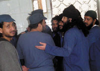Convicts talk while waiting for their verdicts to be passed. Yemen Times photo by Mohamed al-Qadhi