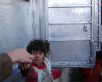 A 5-year-old child begs from passersby. Samira spends 10 hours per day begging near shops